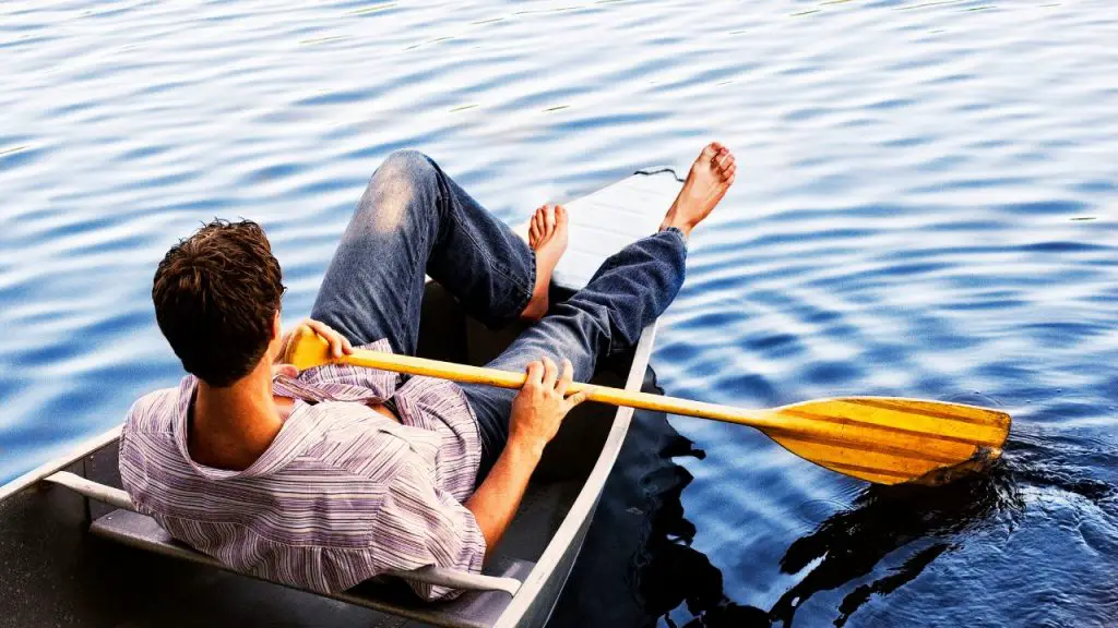 boy lying on the boat