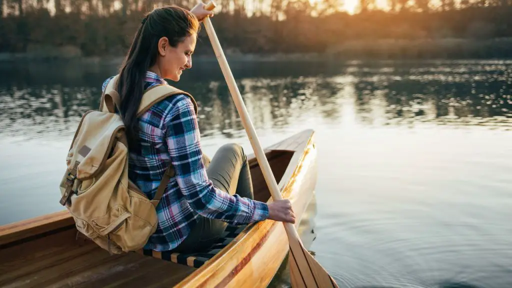 girl sitting rowing boat