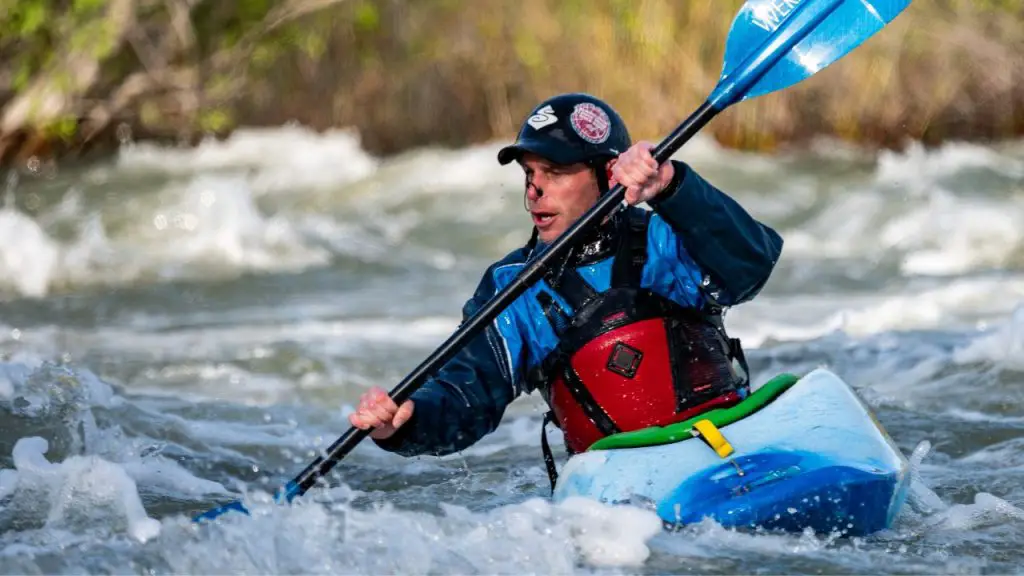 A man is adventure kayaking