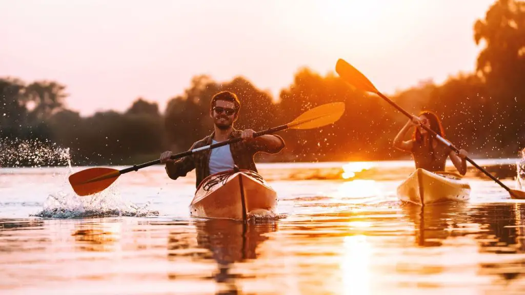 Couple doing kayaking with happy faces