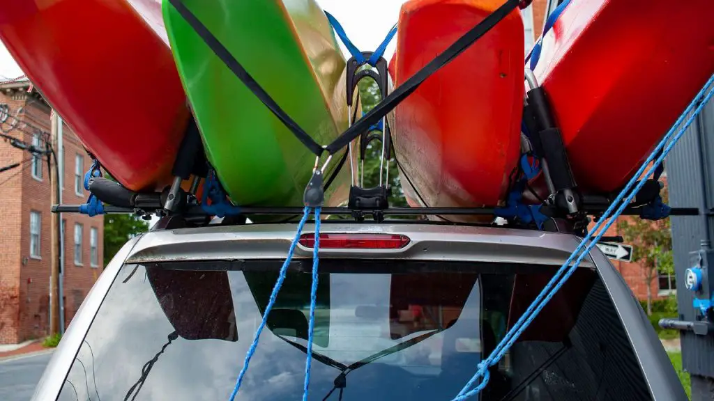 Four kayaks on suv