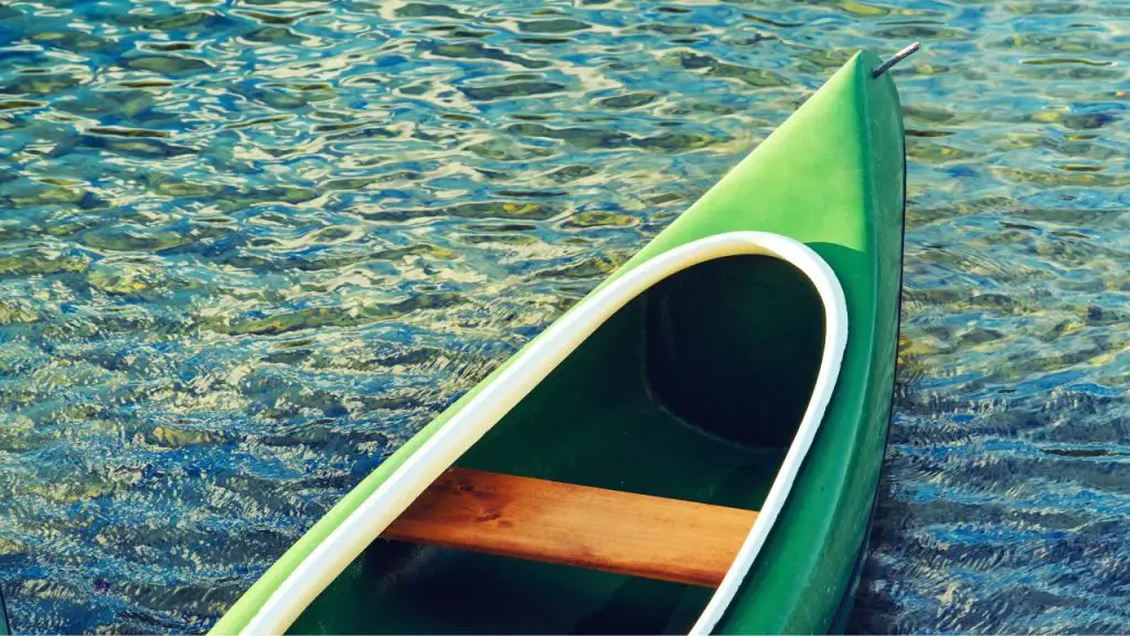 Green Plastic Canoe on Lake