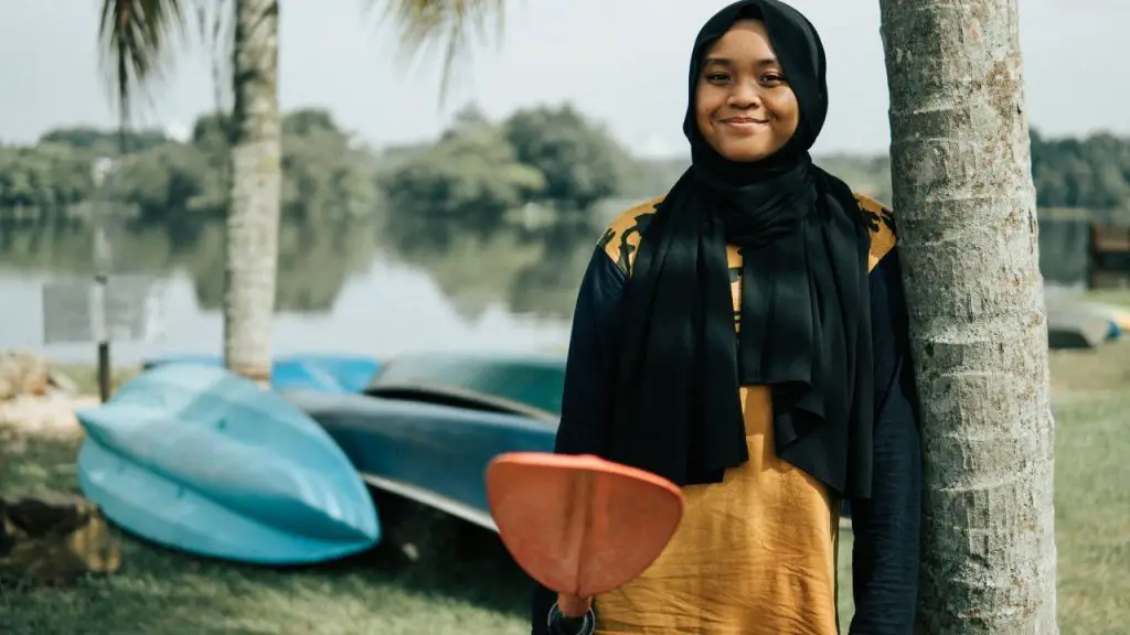 Portrait of asian girl kayaking at river