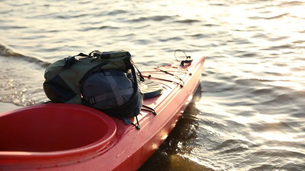 Red Kayak with Bags on River