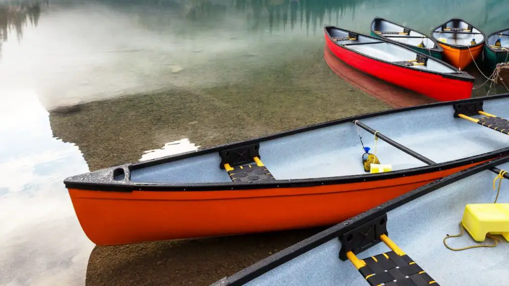 canoes on the calm lake water