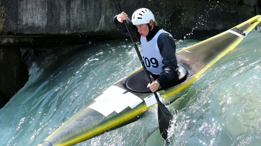 kayaker is kayaking over a waterfall