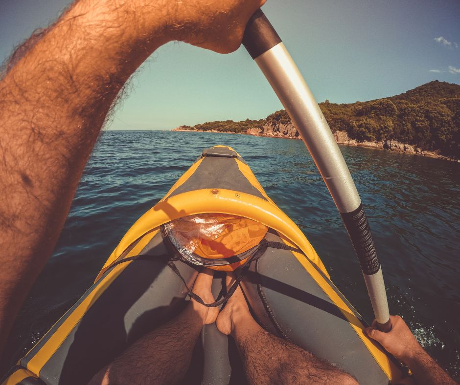 A man is paddling Inflatable kayak in the sea