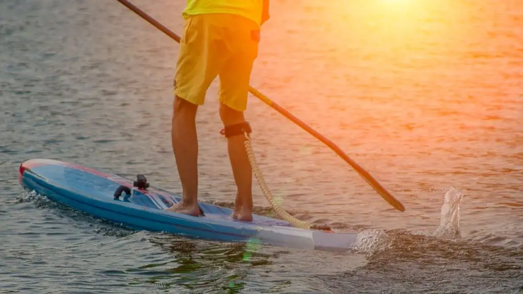 A man is paddling Paddleboard