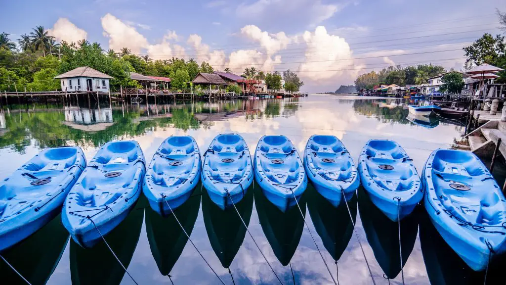 Eight blue kayaks on the river