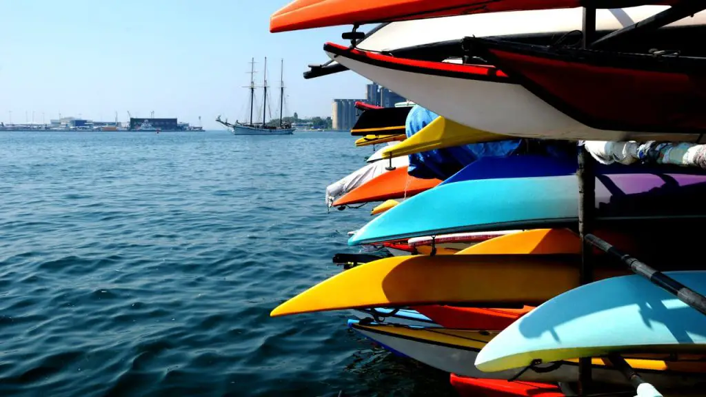 Kayaking yard with colorful kayaks