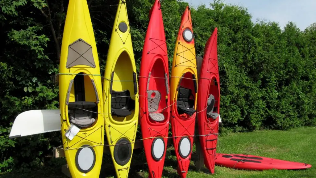 Kayaks of different colors and sizes