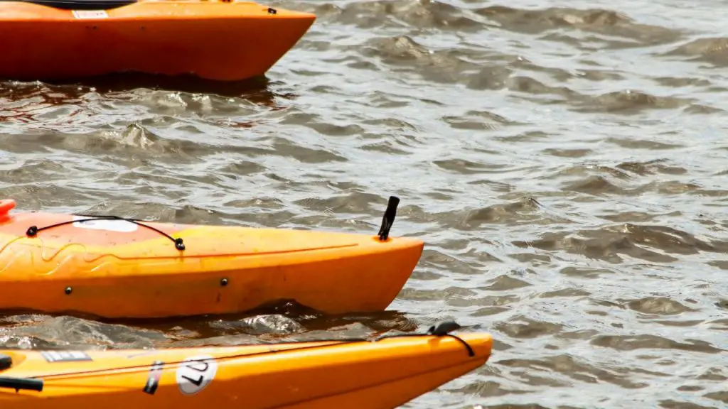 Kayaks on the river with big waves