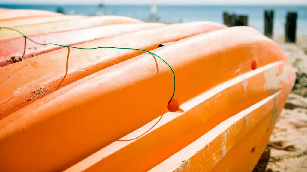 Kayaks are being tied together through the scup hole by rope.