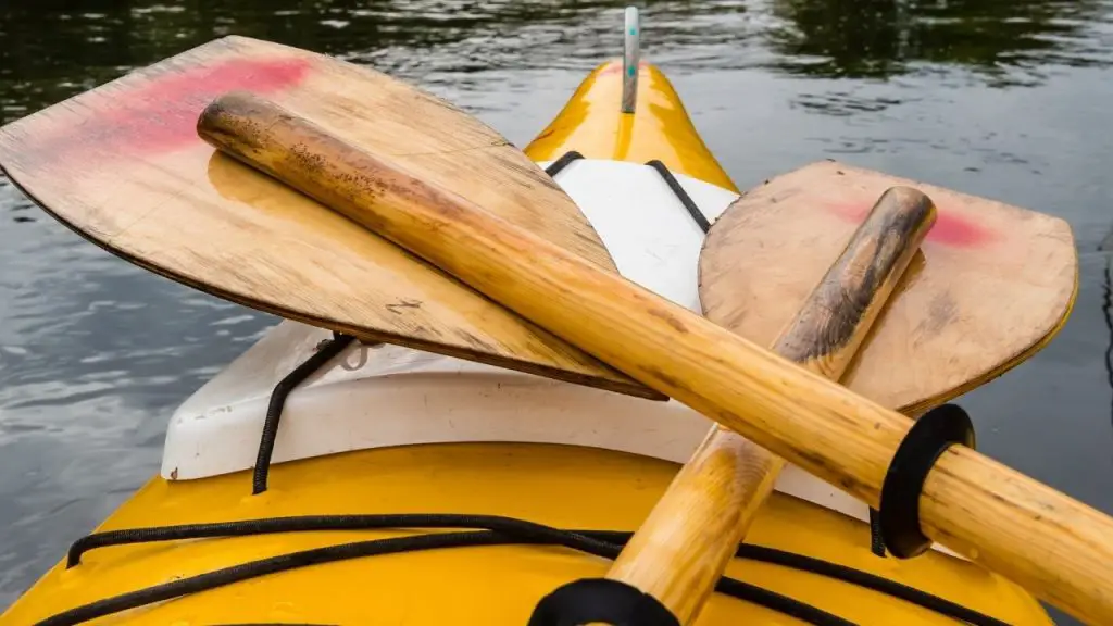 Two wooden paddle on a kayak