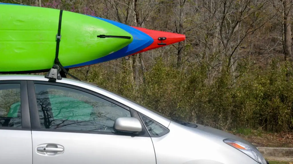 3 kayaks on car roof rack