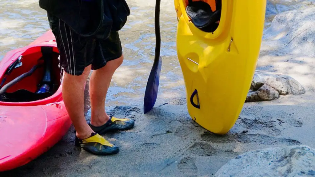 Kayaker is wearing best water shoes