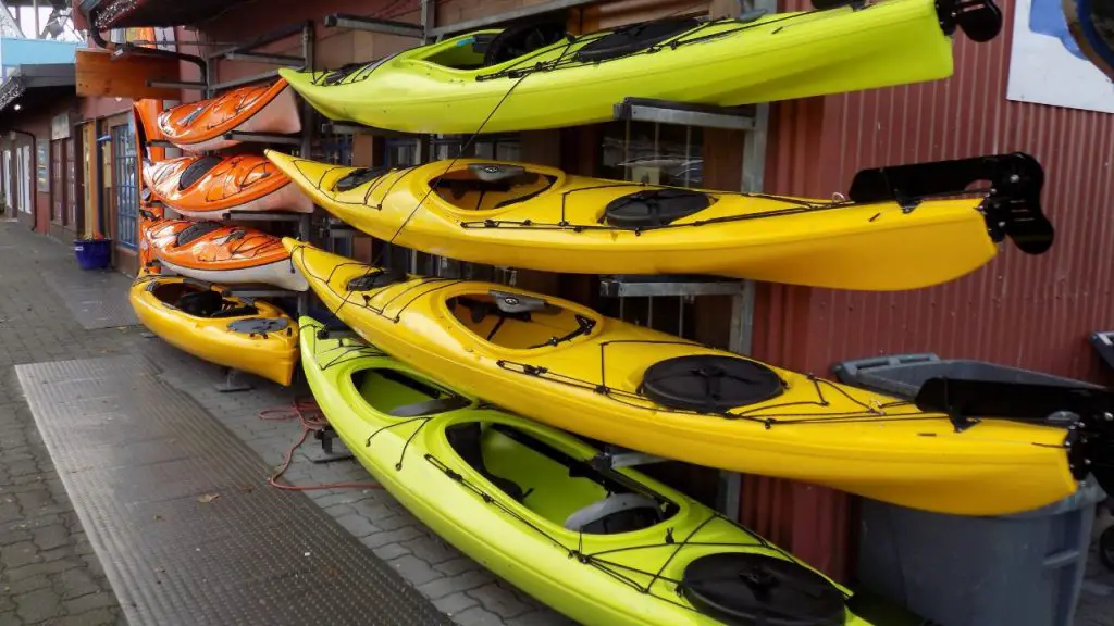 Kayaks on racks are stored outside