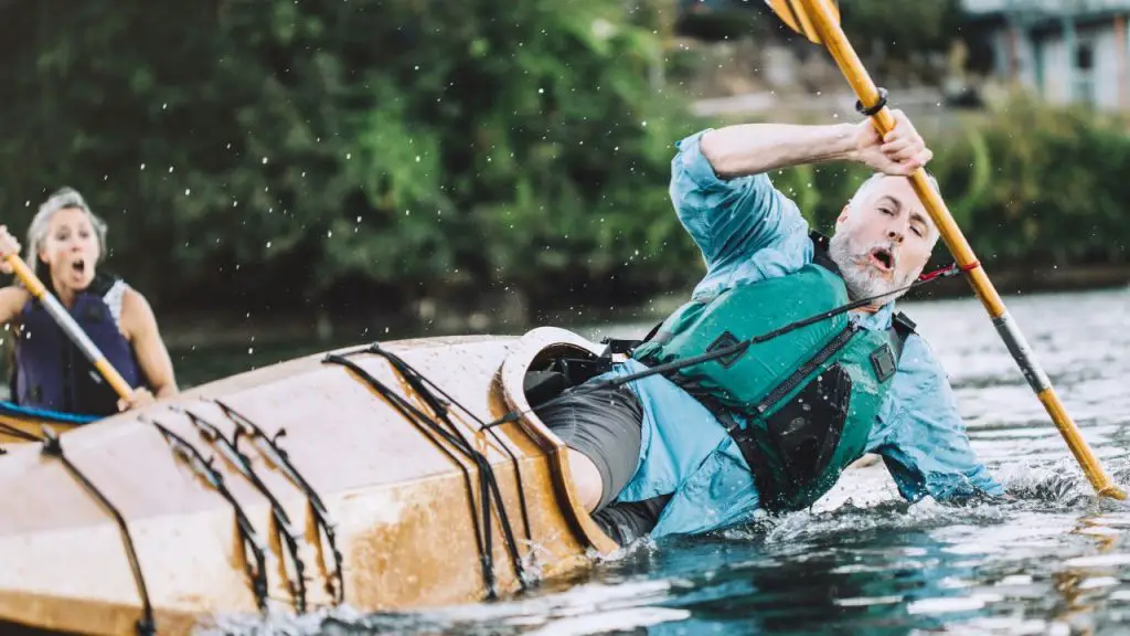 A Man is surprised when the kayak capsize